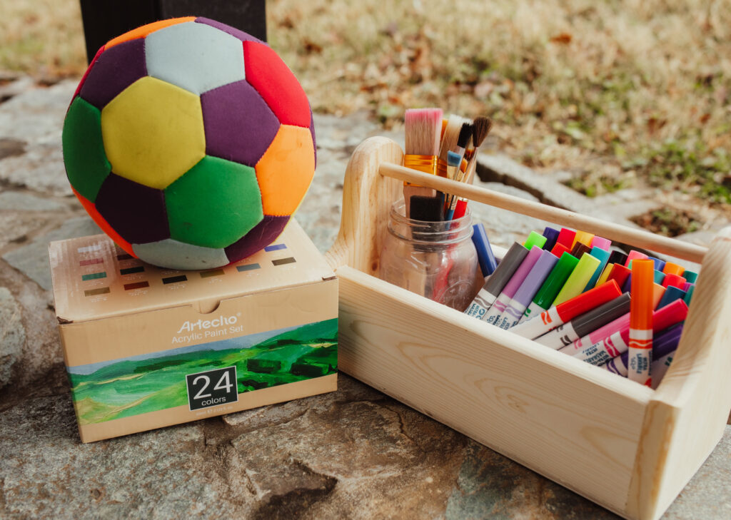 A soccer ball and a set of magic markers for children to play with.